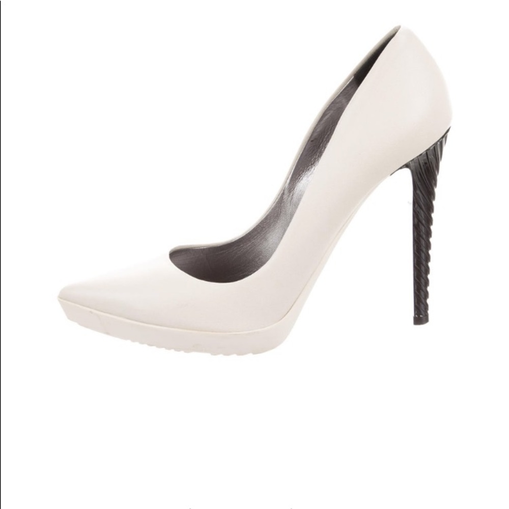 Jimmy Choo Ivory leather pumps with rubber soles.